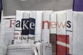 Fake news on newspapers background Royalty Free Stock Photo