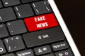 Fake news on Red Enter Button on black keyboard Royalty Free Stock Photo