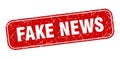 fake news stamp. fake news square grungy isolated sign. Royalty Free Stock Photo