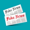 Fake News symbol - newspapers on blue background Royalty Free Stock Photo