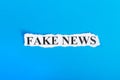 FAKE NEWS text on paper. Word FAKE NEWS on torn paper. Concept Image Royalty Free Stock Photo