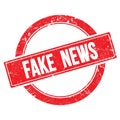 FAKE  NEWS text on red grungy round stamp Royalty Free Stock Photo