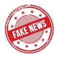 FAKE NEWS text written on red grungy round stamp Royalty Free Stock Photo