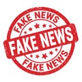 FAKE NEWS text written on red round stamp sign Royalty Free Stock Photo