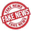 FAKE NEWS text written on red round stamp sign Royalty Free Stock Photo