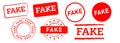 fake rectangle and circle red rubber stamp label sign false hoax scam information Royalty Free Stock Photo