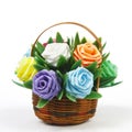 fake rose flower varicolored in rattan basket
