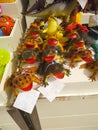 Fake rubber frogs and toads for sale as games in a children`s shop display