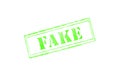 `FAKE` rubber stamp over a white background Royalty Free Stock Photo