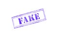 `FAKE` rubber stamp over a white background