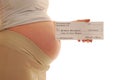 Fake welfare check held by pregnant woman Royalty Free Stock Photo