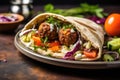 falafel balls in a pita pocket with fresh veggies