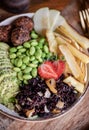 Falafel, edamame, avocado, strawberry, potato and brown rice bowl Royalty Free Stock Photo