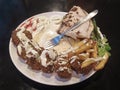 Falafel, french fries potato and humus on plate