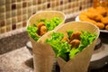 Falafel and fresh salad in pita bread with tahini sauce.