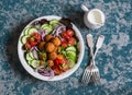 Falafel and vegetables salad. Delicious vegetarian food concept. Buddha bowl on dark background Royalty Free Stock Photo