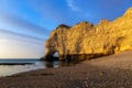 Falaise d`Amont, iconic limestone cliff of Normandy Coast, Etretat, dusk scenery, France