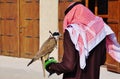 A falconeer with his falcon in Dubai