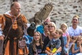 Falconer show casing his skills with an Eurasian eagle owl