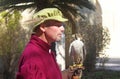 falconer speaking with his peregrine, at the Upper Barraca Gardens, Valetta, Malta