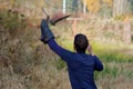 Falconer training a perigrine falcon with a lure