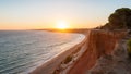 Falesia Beach seen from the cliff at sunset