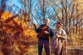 Fall activities. Senior family couple walking in autumn park. Man and woman enjoying nature outdoors talking Royalty Free Stock Photo