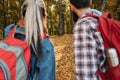 Fall adventures couple backpacks autumn forest