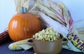 Fall and autumn with sugar pumpkin, indian corn and caramel corn