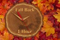 Fall back 1 hour time change with wood clock Royalty Free Stock Photo