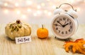 Fall Back Daylight Saving Time concept on wooden board Royalty Free Stock Photo