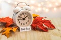 Fall Back Daylight Saving Time concept on wooden board Royalty Free Stock Photo