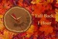 Fall back 1 hour time change with wood clock Royalty Free Stock Photo