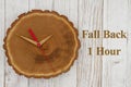 Fall back 1 hour time change with wood clock Royalty Free Stock Photo