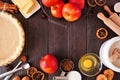 Fall baking frame with apple pie ingredients on a dark wood background