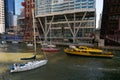 Fall Bridge Lift and Boat Run with a Yellow Water Taxi and Sailboats in Downtown Chicago