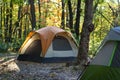 morning light shining on edge of tent in woods on crisp fall morning