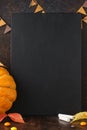 Fall chalkboard background with pumpkin, leaves and candies