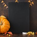 Fall chalkboard background with pumpkin, leaves and candies