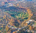 Fall in the City. Aerial View of a colorful autumn foliage surrounding a golf course Royalty Free Stock Photo