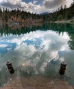 Fall color forest and foliage landscape surround an idyllic mountain lake in the Alps of Switzerland on a late autumn day with ref Royalty Free Stock Photo