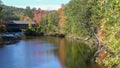 Fall colors around the henniker covered bridge and the contoocook river Royalty Free Stock Photo