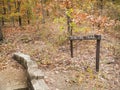 Nature Trail in an autumn forest, sign, rustic walkway