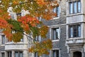 Fall colors in front of gothic style stone college building