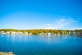 Fall colors and New england homes across harbor of Boothbay town and harbor, Maine USA Royalty Free Stock Photo