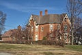 Fall colors surround a red brick victorian home Royalty Free Stock Photo