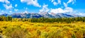 Fall Colors surrounding the Cloud covered Peaks of the Grand Tetons In Grand Tetons National Park Royalty Free Stock Photo