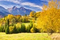 Fall coloured trees near Zdiar village under Belianske Tatras mountains during autumn Royalty Free Stock Photo