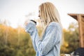 Fall concept - autumn woman drinking coffee Royalty Free Stock Photo