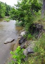 Fall Creek bordered by erosion along bank Royalty Free Stock Photo